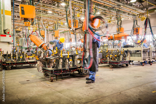 robots welding in a car factory