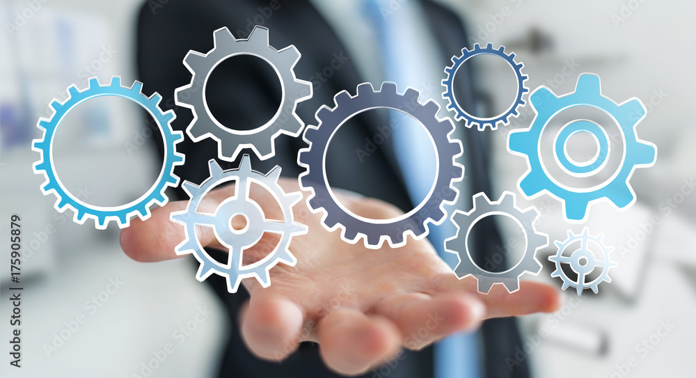 Businessman holding hand-drawn gears icons Businessman holding hand-drawn gears icons