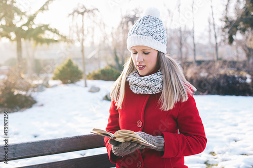 Young woman reading a book