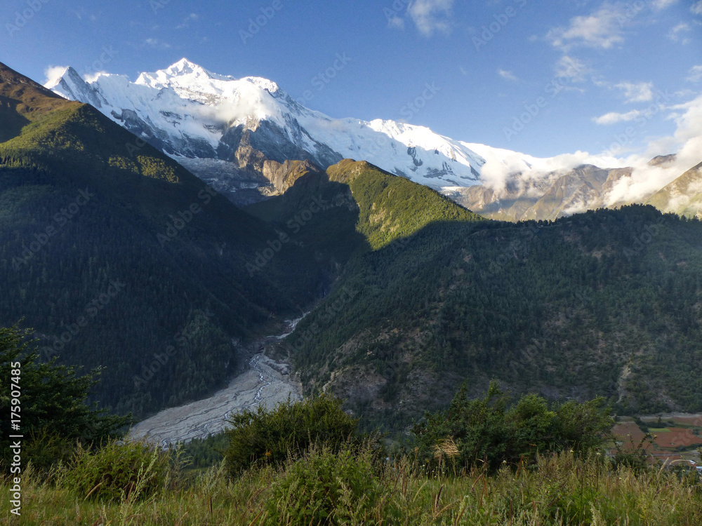 Morning view of Annapurna from Upper Pisang, snow capped Himalayas in morning soft sun light, Annapurna Circuit trek 
