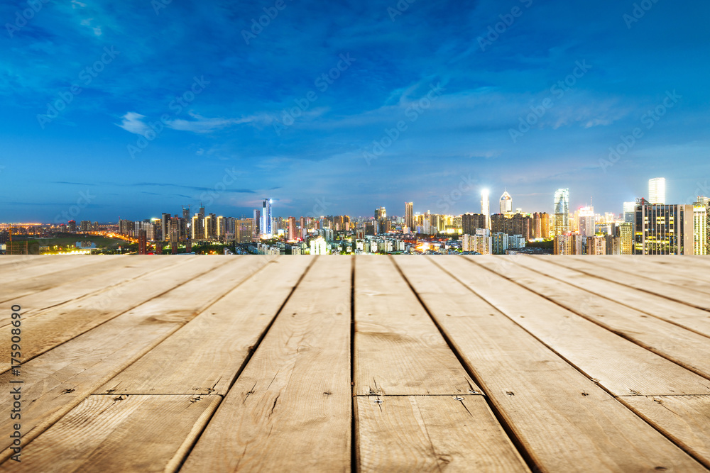 Obraz premium empty wooden floor with cityscape of hangzhou at twilight