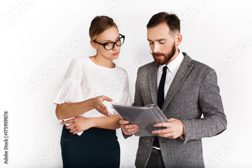 Man and woman dressed in office style debate about something