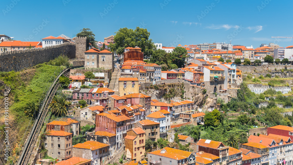 Orange tiles roofs in Porto, Portugal, panorama with typical houses on the hill
