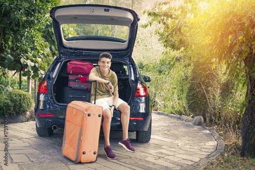 family travel with suitcases and car