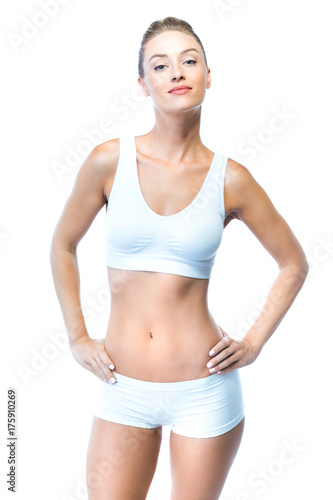Beautiful young woman with beautiful body posing over white background.