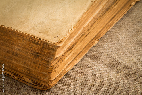 Old vintage book with yellowed aged pages, closeup