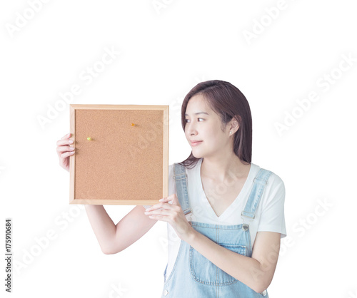 Closeup asian woman with cork board in hand and look at the space in cork board isolated on white background with clipping path