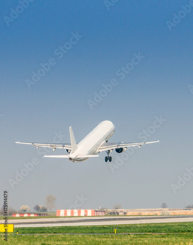 Photography Airplane is taking off at airport.