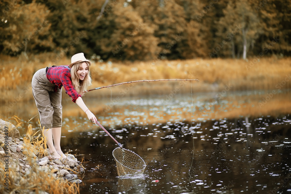 Girl in autumn with a fishing rod Girl in autumn with a fishing rod