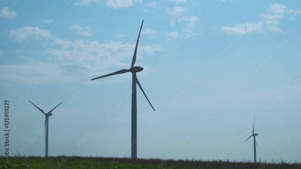 Wind farm in the field, rotating blades, alternative renewable energy sources. Wind turbine.
Wind farm in the field, rotating blades, alternative renewable energy sources. Wind turbine.