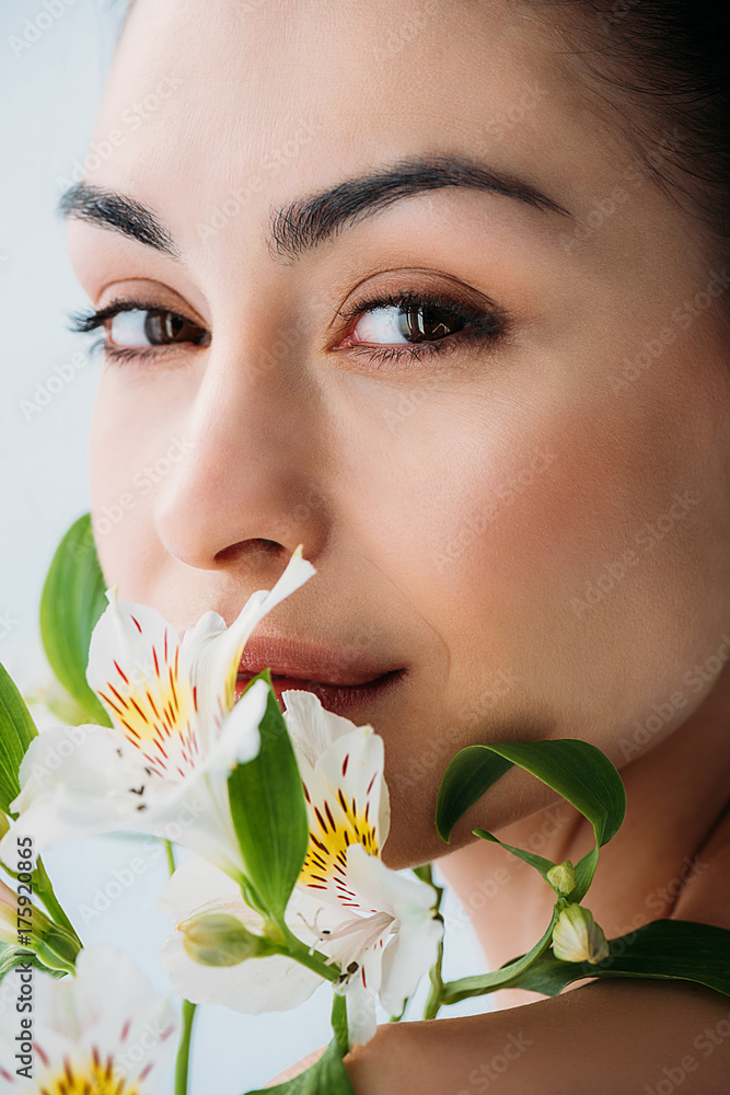 Fototapeta premium beautiful woman with white lilies
