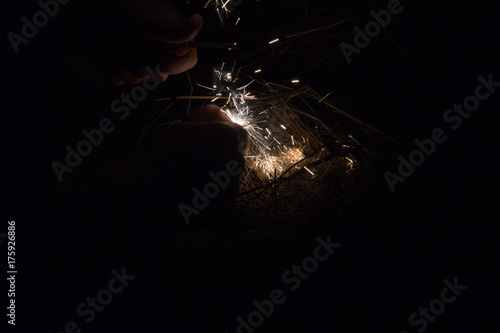 Wallpaper Mural startng a fire with a fire steel Torontodigital.ca