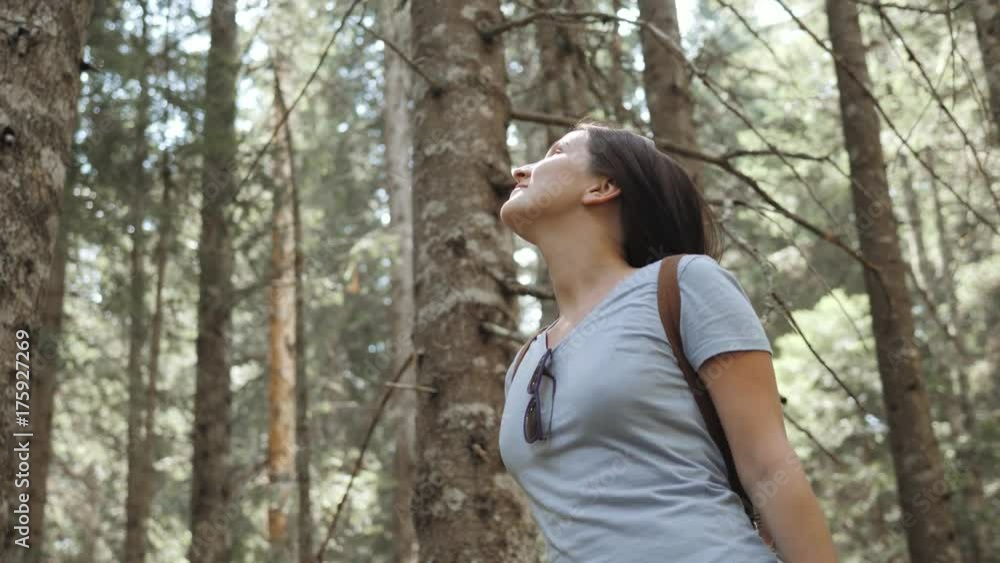Portrait of a Happy Woman In Forest, Girl Enjoy Wood, Tourist With Backpack In National Park, Travel Lifestyle Portrait of a Happy Woman In Forest, Girl Enjoy Wood, Tourist With Backpack In National Park, Travel Lifestyle