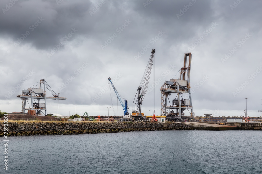Cranes and lifts in industrial seaport of Sines.