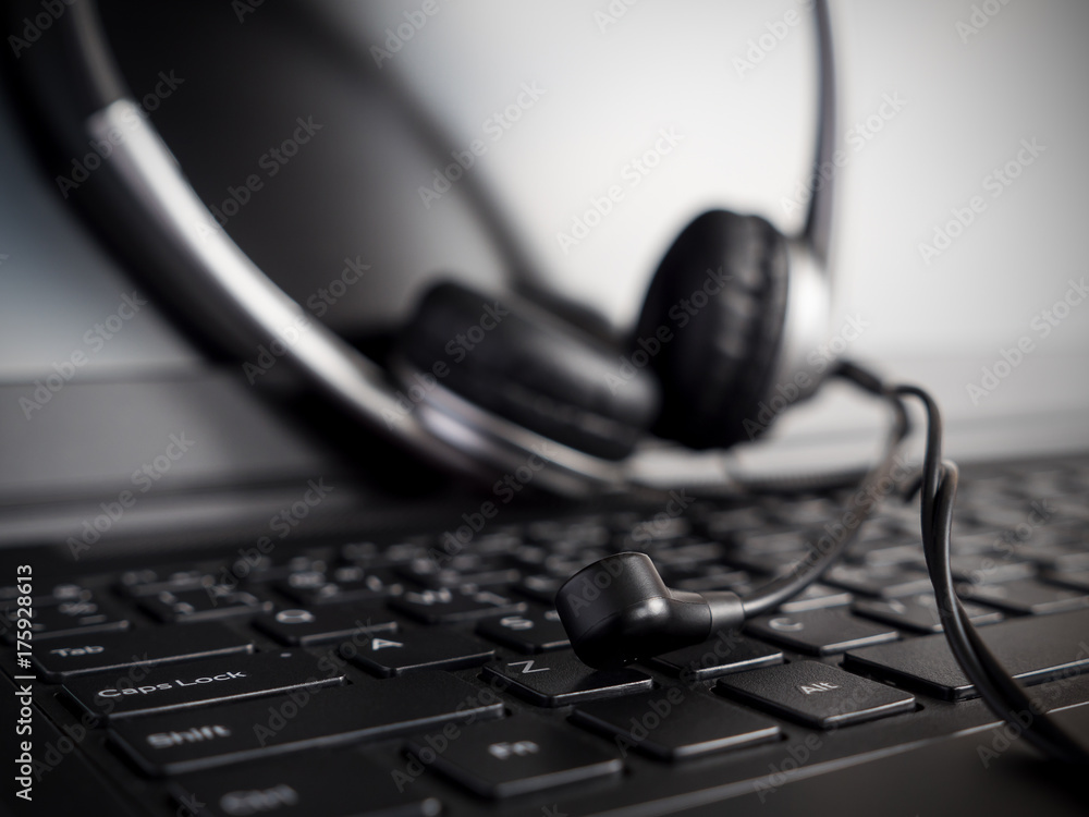 Closeup headset on laptop keyboard 2 Closeup headset on laptop keyboard 2