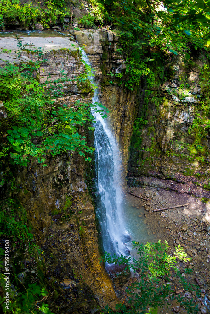 Photo of high waterfall in Carpathian mountains