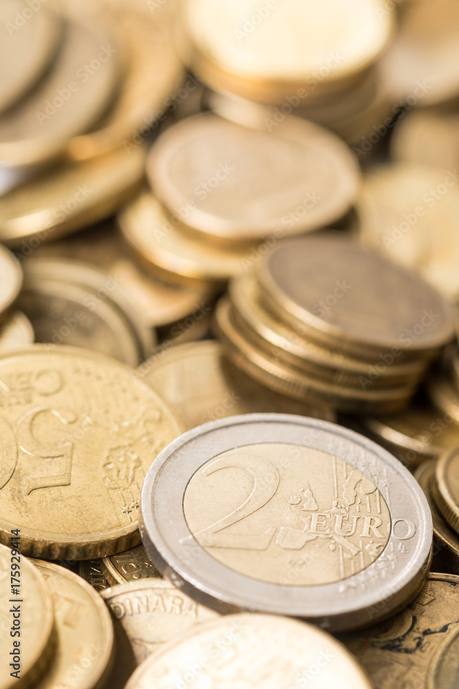 Two euro money metal coin on the pile of metal euro coins Two euro money metal coin on the pile of metal euro coins
