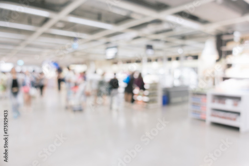 Blurred background - Store of shopping mall blur background with bokeh. vintage filtered image. © tirachard