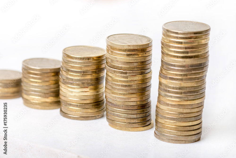 Stock steps of metal coins isolated on white background Stock steps of metal coins isolated on white background