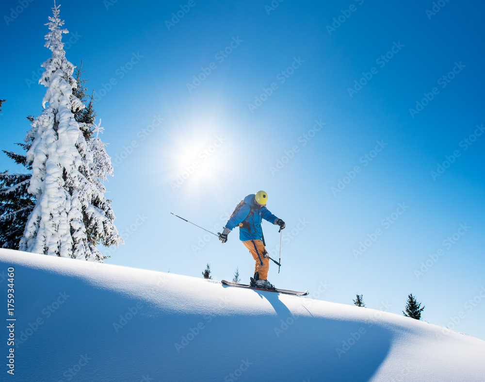 Full length shot of a professional freeride skier skiing on top of the mountain copyspace active people living leisure hobby extreme slope snow winter seasonal sport