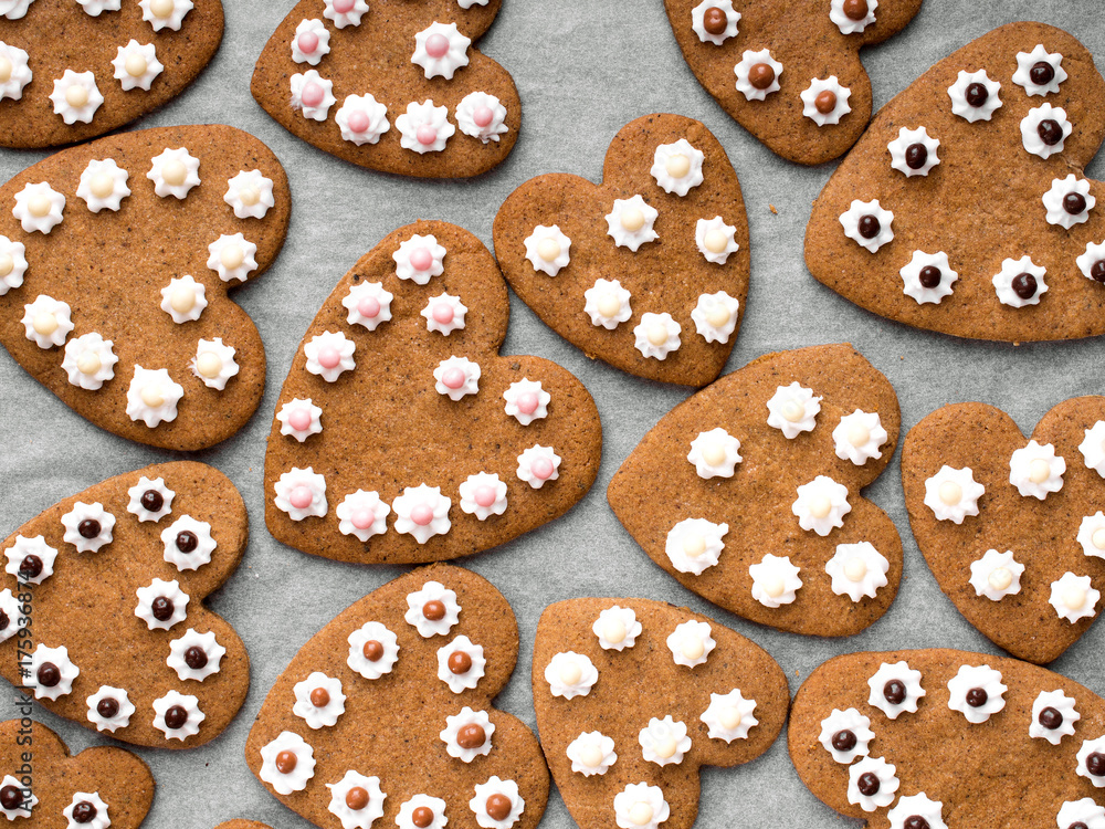 Heart shaped cookies on baking paper background Heart shaped cookies on baking paper background