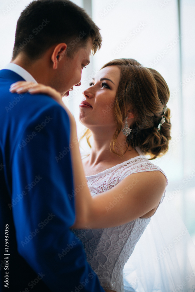 bride and groom on background clear windows