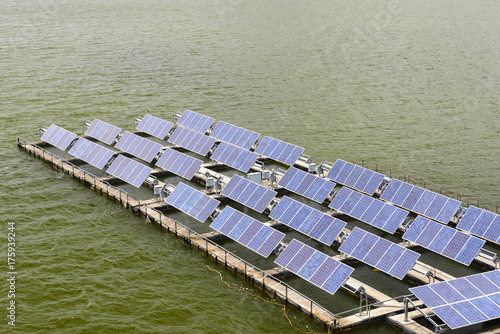 the solar panel floating on the water at the dam. conservative energy system by solar energy. photo