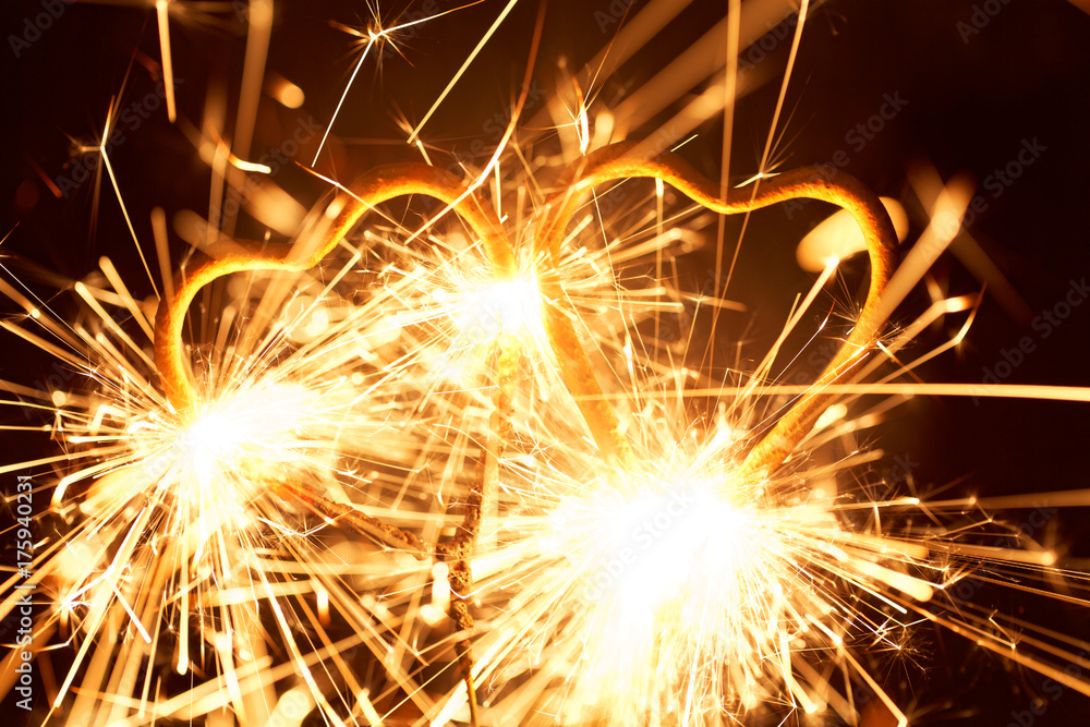 Burning sparkler in form of a heart Burning sparkler in form of a heart
