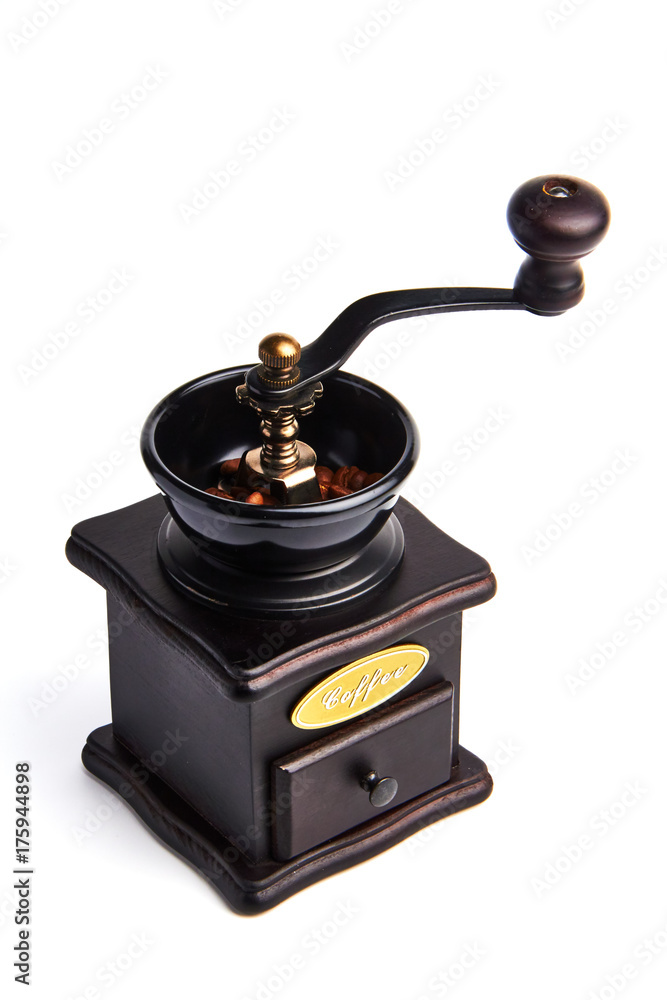 Manual coffee grinder./A hand grinder with coffee beans. Manual coffee grinder./A hand grinder with coffee beans.