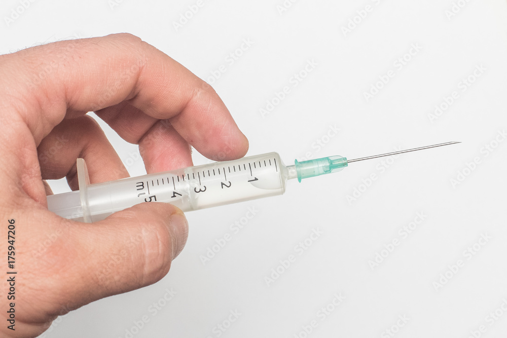 syringe in hand syringe in hand