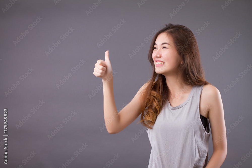 exited woman giving thumb up studio isolated portrait exited woman giving thumb up studio isolated portrait