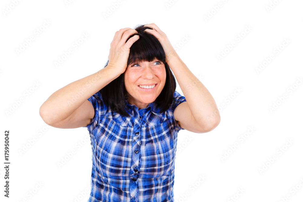 Emotional portrait of Woman Has Shocked or Surprised, holding her head both hands. Dressed in plaid shirt blue color, isolated on white background Emotional portrait of Woman Has Shocked or Surprised, holding her head both hands. Dressed in plaid shirt blue color, isolated on white background