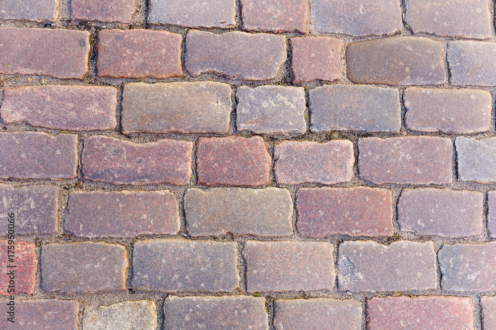 Background old granite paving stones in old town