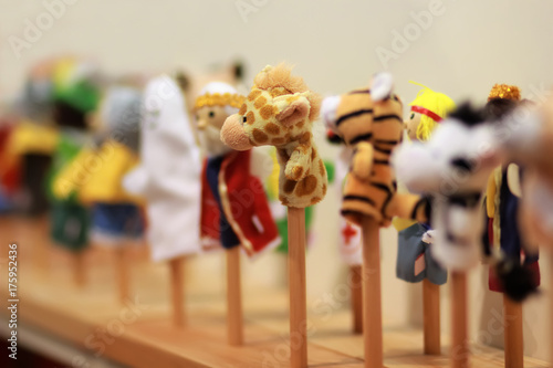Toy puppets on wooden sticks for preschool nursery theatre. Puppet theatre art.