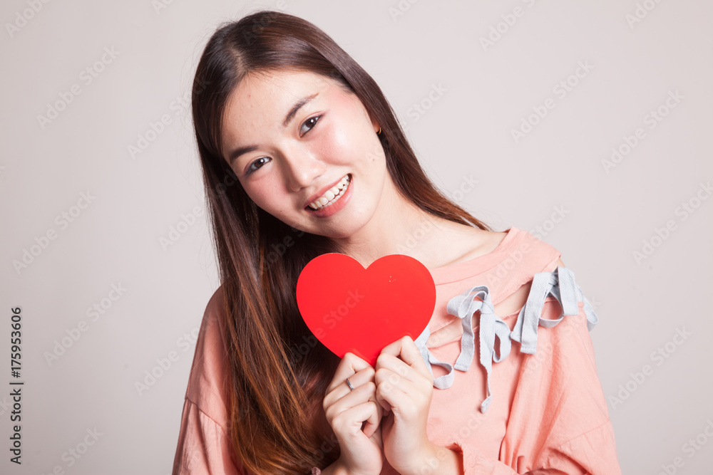 Asian woman with red heart. Asian woman with red heart.