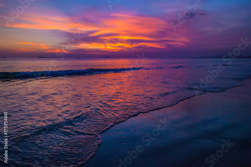 Purple sunset in Sanya, Hainan, China. Colorful madness from the clouds, merging with the sea.
