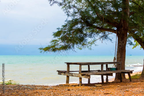 Wooden benches and table by the sea