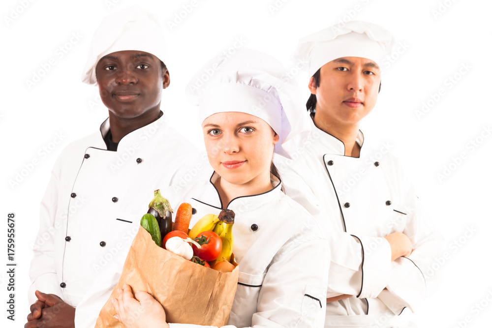 Multi-ethnic Group Of Cooks Holding Groceries Multi-ethnic Group Of Cooks Holding Groceries