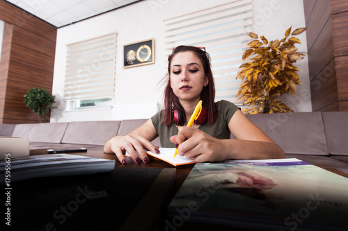 Obraz na plátně college with hard-working young girl books.