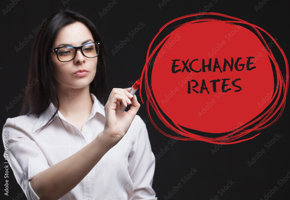 The concept of marketing, technology, the Internet and the network. A young businessman shows what is important for business: Exchange rates The concept of marketing, technology, the Internet and the network. A young businessman shows what is important for business: Exchange rates