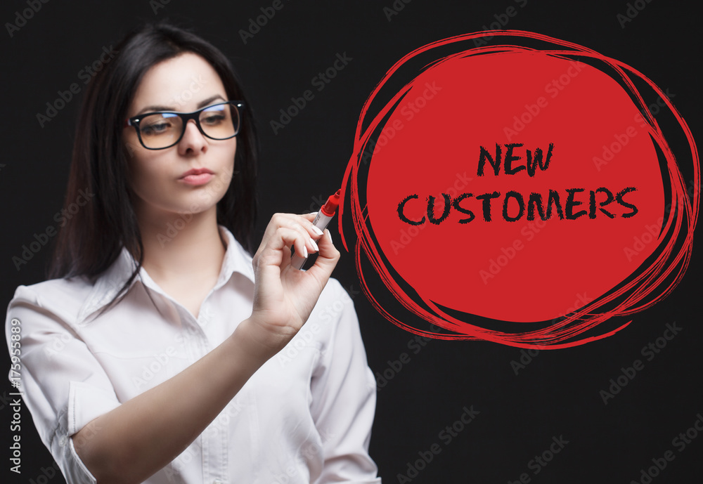The concept of marketing, technology, the Internet and the network. A young businessman shows what is important for business: New customers The concept of marketing, technology, the Internet and the network. A young businessman shows what is important for business: New customers