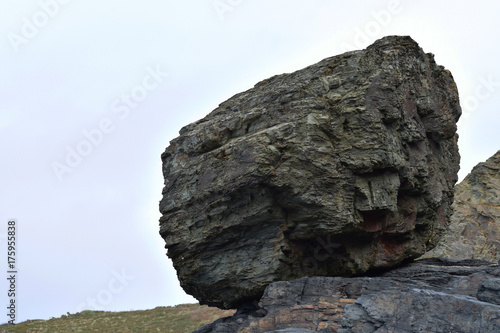 Weathered boulder on The cliffs Tregardock Beach © Tim