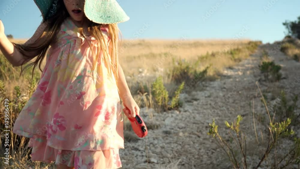 Little girl running with puppy. Little girl running with puppy.