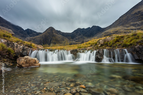 Moody clouds over the Cuillin Range with waterfall at the Fairy Pools, Isle of Skye, Scotland, UK.