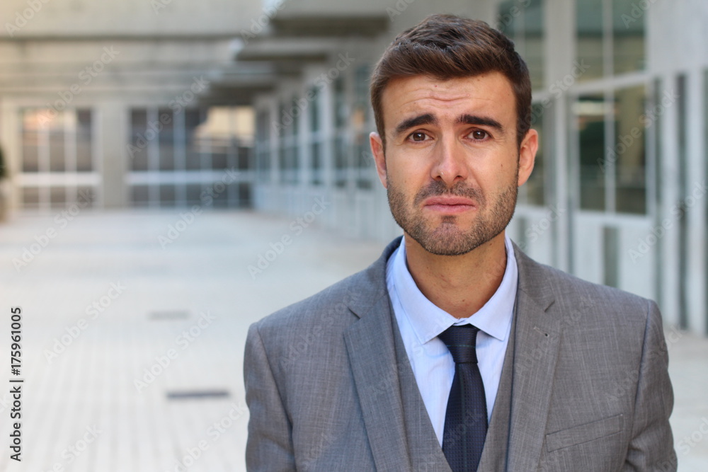 Businessman crying with copy space Businessman crying with copy space