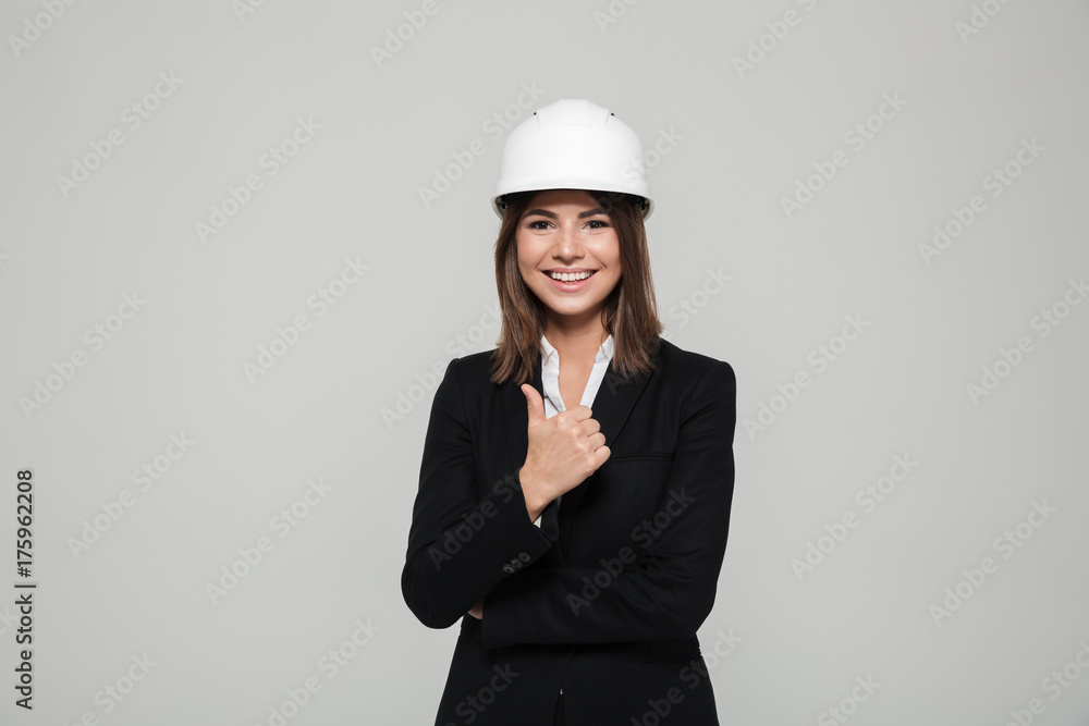Portrait of a satisfied confident woman in hard hat Portrait of a satisfied confident woman in hard hat