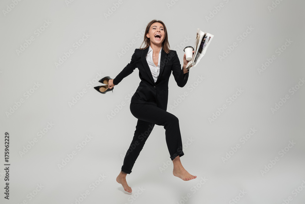 Full length portrait of cheery satisfied businesswoman Full length portrait of cheery satisfied businesswoman