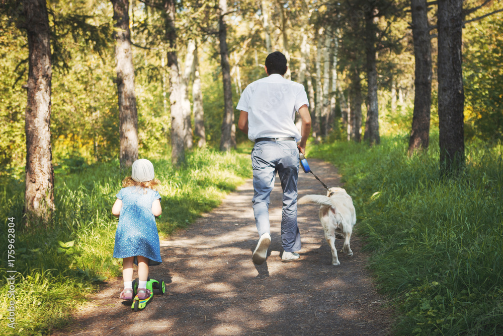 happy family with pet dog at picnic in a Sunny summer day. pregn happy family with pet dog at picnic in a Sunny summer day. pregn