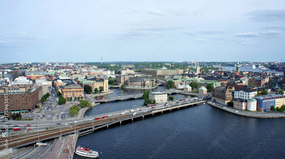 Aerial view of roads with car traffic and beautiful cityscape from the observation deck of Town Hall, way to Gamla Stan, Stockholm, Sweden