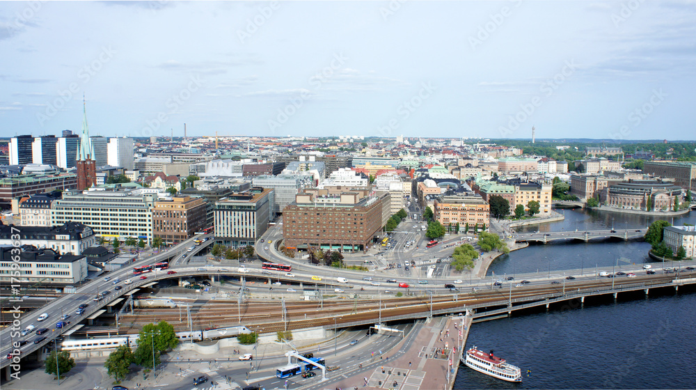 Aerial view of roads with car traffic and cityscape from the observation deck of Town Hall, Stockholm, Sweden
